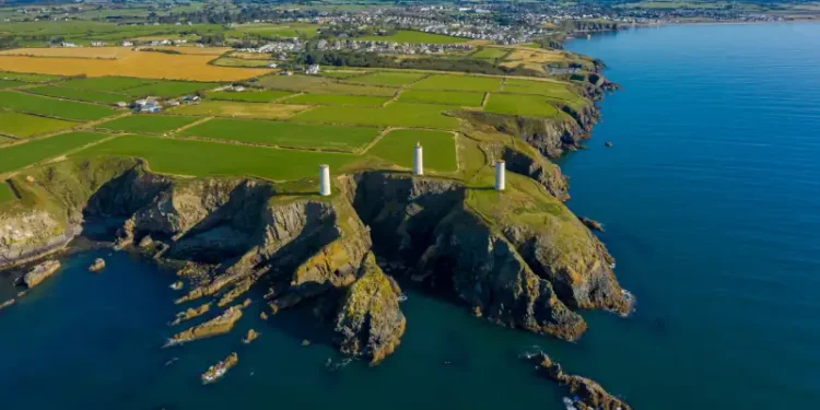 Aerial view, The Metal Man is a 3-metre tall cast-metal figure of a sailor pointing seawards.