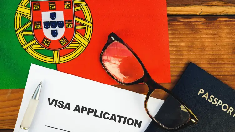 Flag of Portugal , visa application form and passport on table