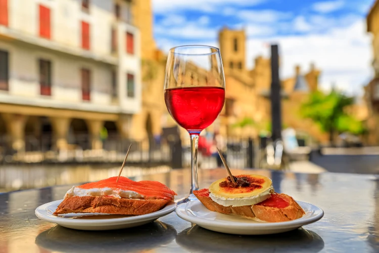 Tostadas with smoked salmon and soft baked cheese. cost of living in Spain