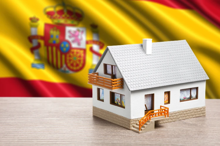 Classic house against Spanish flag background