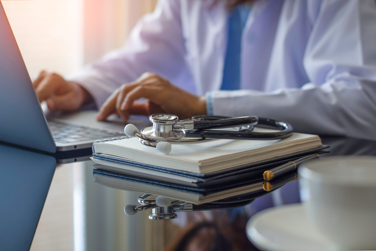 Female doctor in white coat.