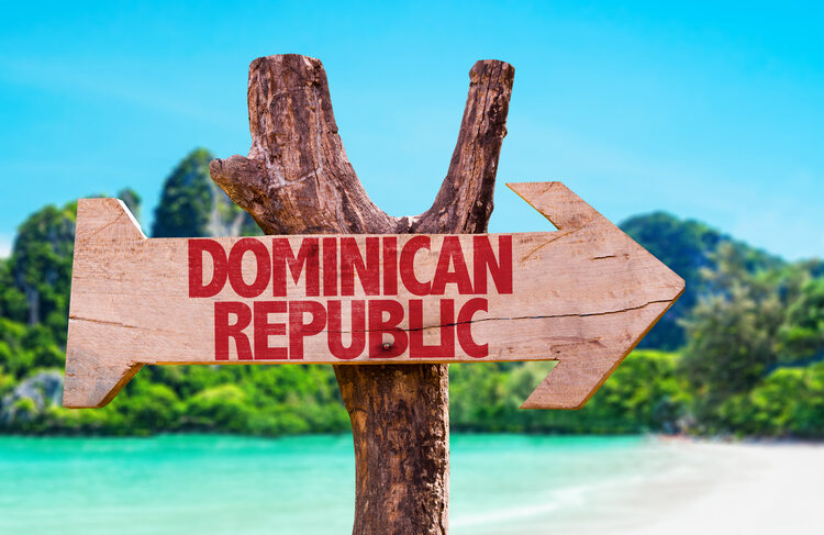 Dominican Republic wooden sign with beach background. work in the dominican republic