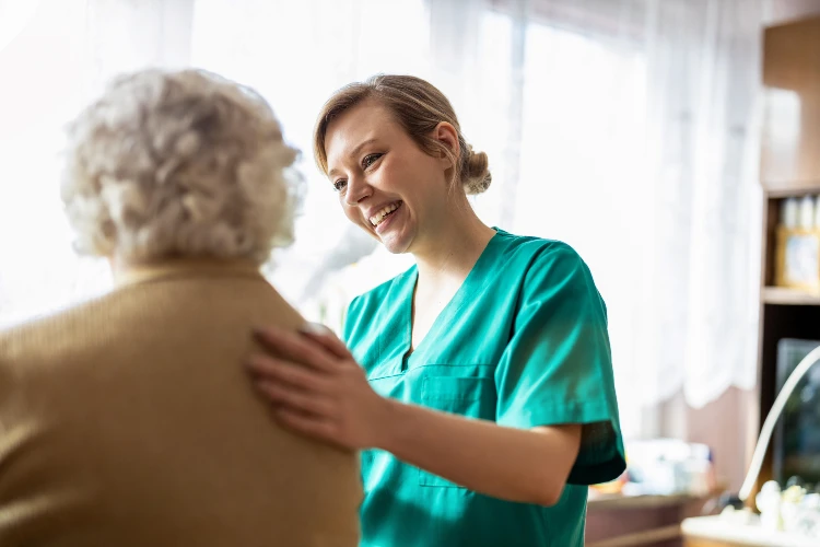 Friendly nurse supporting an elderly lady. limassol