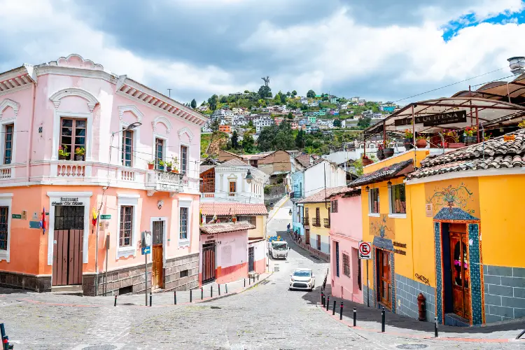 Colorful street under panecillo mountain at Quito, Ecuador