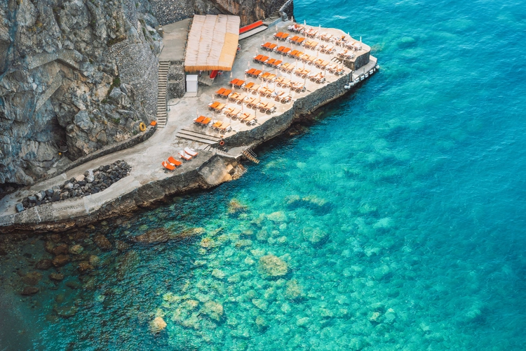 Clear blue waters in a Positano beach, in Italy.