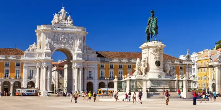 Beautiful image of the gate and statue of King Jose on the Commerce square (Praca do Comercio) in Lisbon, Portugal