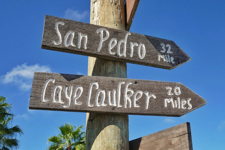 Belize signpost san pedro and caye caulker
