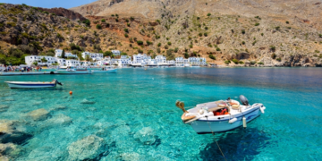 Small motorboat at clear water bay of Loutro town on Crete island, Greece