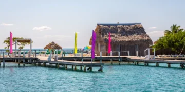 Small tropical island at Barrier Reef with paradise beach, known for diving, snorkeling and relaxing in the beach. Caribbean Sea, Belize, Central America.