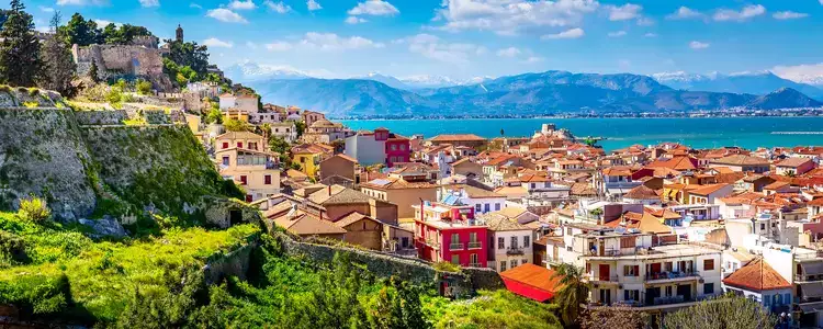 Nafplio, Greece aerial view and snow mountains.