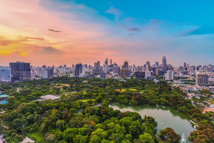 Lumpini park and Bangkok city central business downtown at twilight. invest in thailand