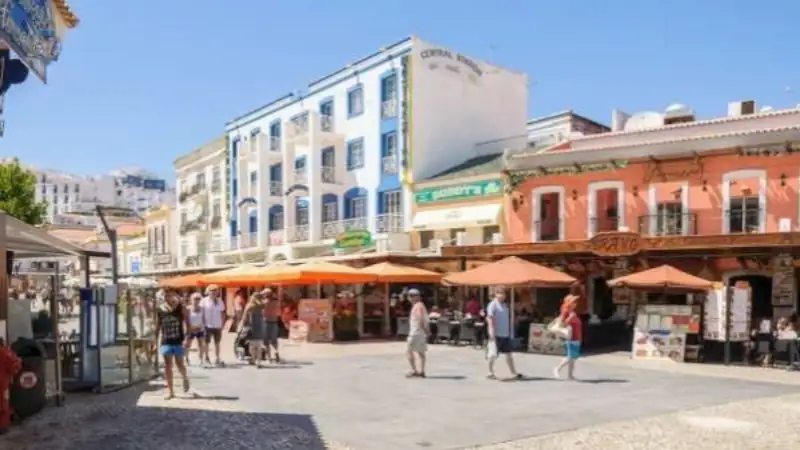 Buildings, outdoor cafés, and shops in Portugal.