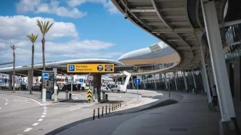 Modern airport terminal exterior.