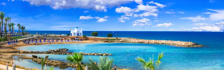 Cyprus island - best beaches. Scenic Louma beach with little church. Elite Retirement Havens