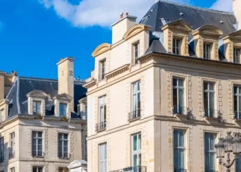 Paris, beautiful buildings place des Victoires, typical parisian facades and windows