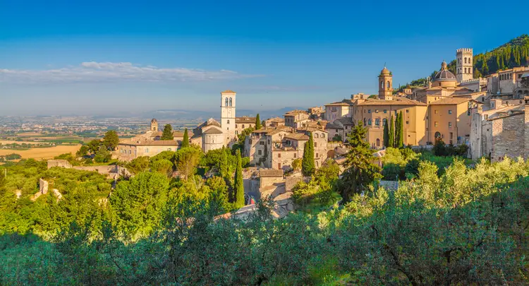 Historic town of Assisi at sunrise, Umbria, Italy. Elite Living