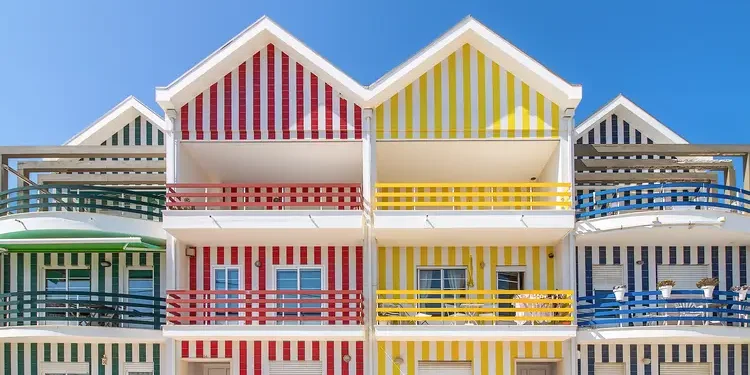 Street with colorful houses in Costa Nova, Aveiro, Portugal. Street with striped houses, Costa Nova, Aveiro, Portugal. Facades of colorful houses in Costa Nova, Aveiro Portugal