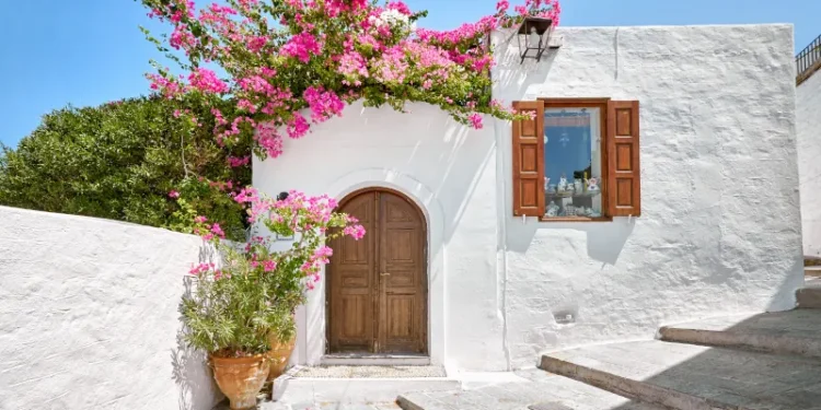 Facade of traditional white house in Lindos town at Rhodes island Stock Photo | Adobe Stock