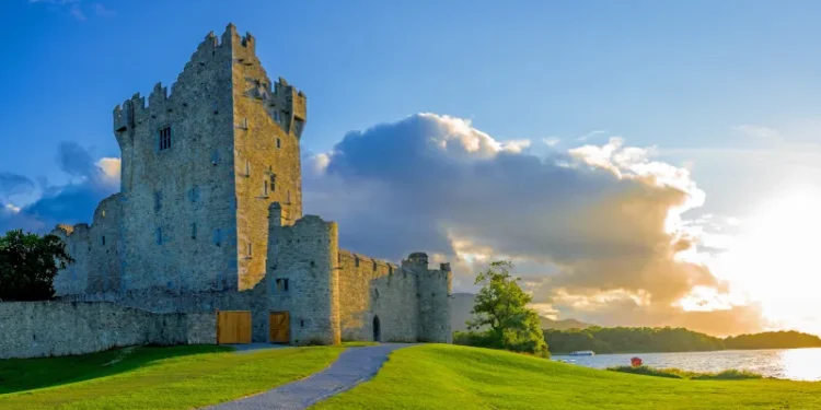 Idyllic landscape of Ross Castle in the Killarney National Park in Ireland. Travel by car through the Ring of Kerry.
