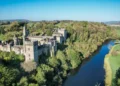 Aerial view of Lismore Castle, County Waterford, Ireland, on a tranquil spring day under a flawless blue sky