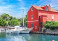 Fisherman's red house on the water. Croatia, Zadar.