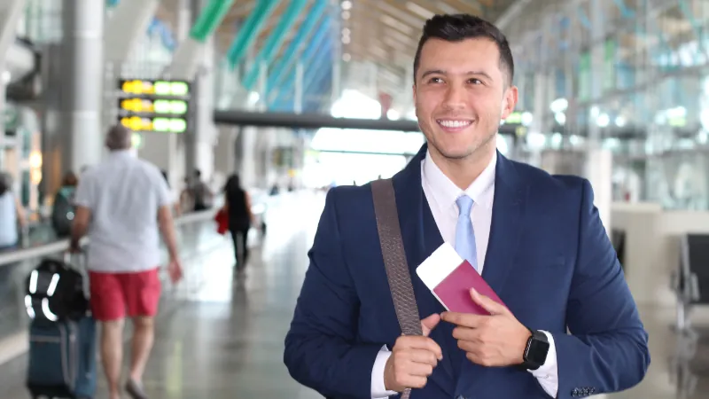 businessman smiling at the airport
