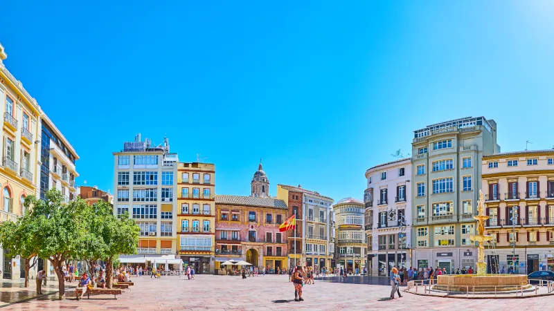 Panorama of Constitution Square with a fountain, Malaga, Spain