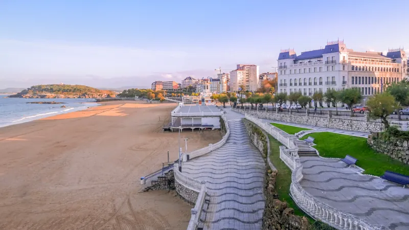 Views of the second beach of El Sardinero ith city historic buildings and the Magdalena peninsula at the back. City of Santander, Spain