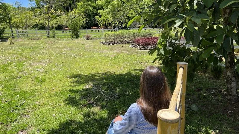 Kathleen Peddicord watching her horses at Los Islotes, Panama