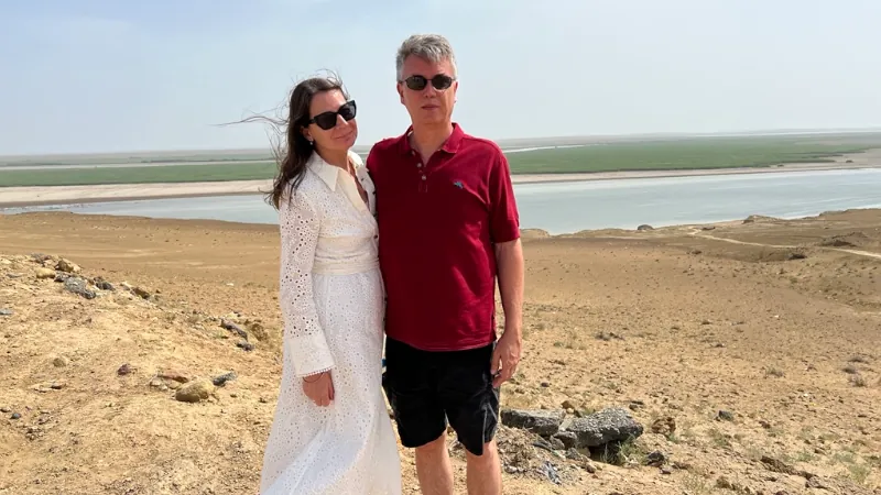 Kathleen Peddicord and Lief Simon at the Uzbekistan/Turkmenistan Bordern