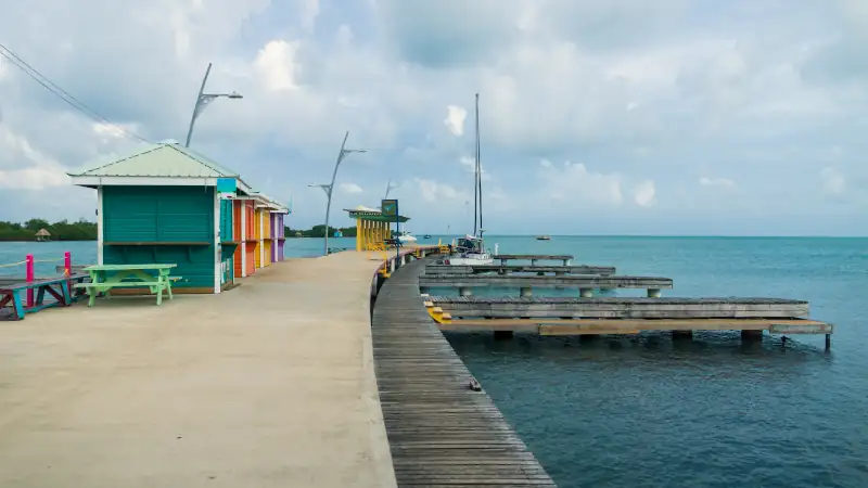 Colorful huts at the boat dock of at the harbor of Placencia, Belize