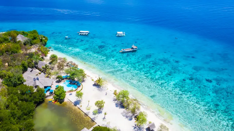 Panorama with a aerial top view as perspective of the Sumilon island beach landing near Oslob, Cebu, Philippines
