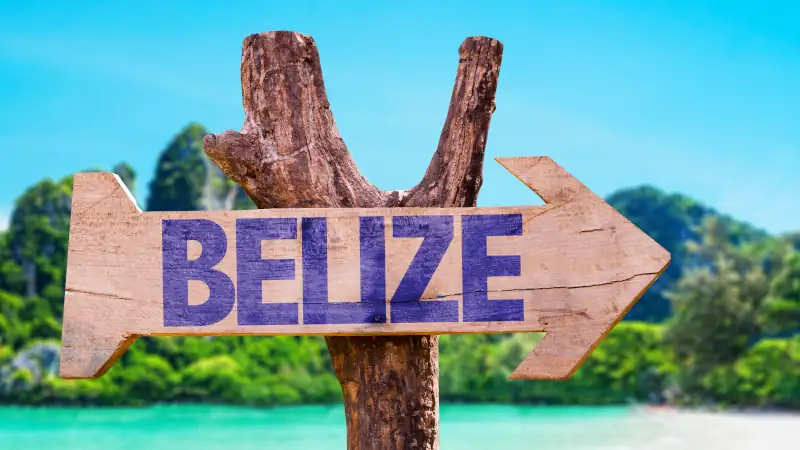 Belize wooden sign with beach background