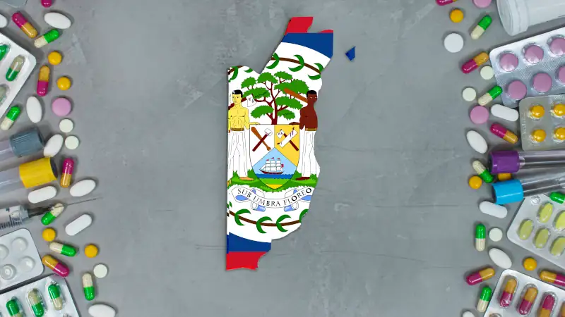Medicine, pills, needles, syringes and Belize map and flag on gray background.