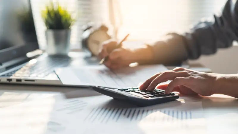 Tax deduction planning concept. Businessman calculating business balance prepare tax reduction.