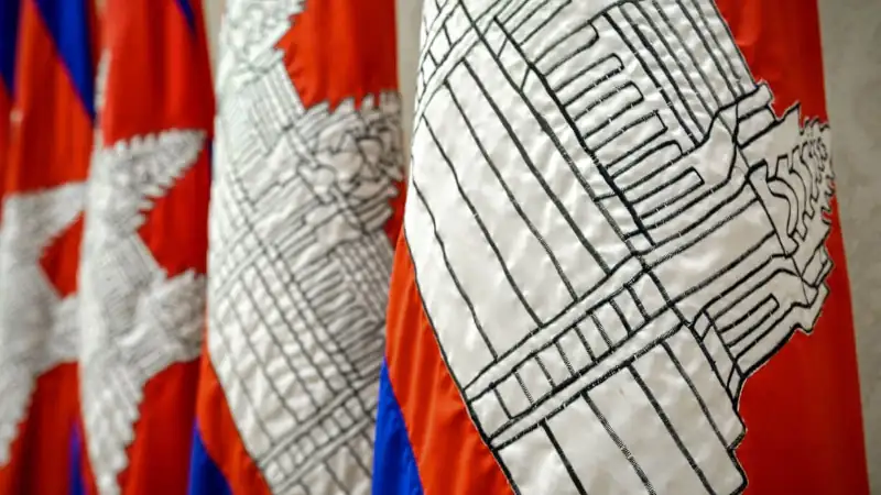 Close up of a group of red white and blue Cambodian flags. cambodia visa