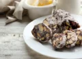 Chocolate salami in a plate over wooden background