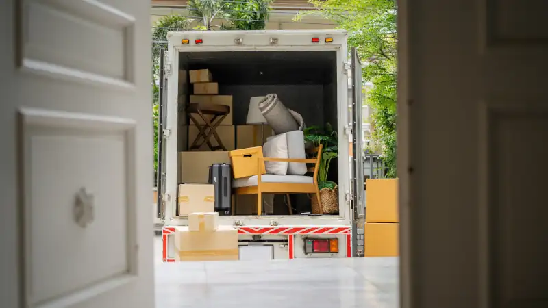 the back of a truck carrying goods moving house