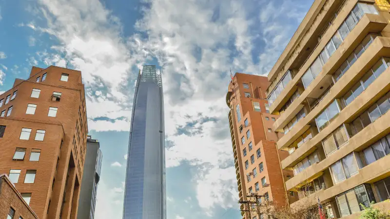 Costanera Center tower on a day with white clouds