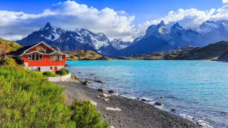 A red house in Torres Del Paine National Park, Chile. Pehoe lake is to the right.