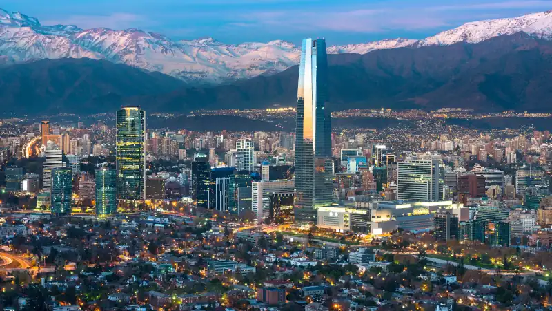 Panoramic view of Providencia and Las Condes districts with Costanera Center skyscraper, Titanium Tower and Los Andes Mountain Range, Santiago de Chile
