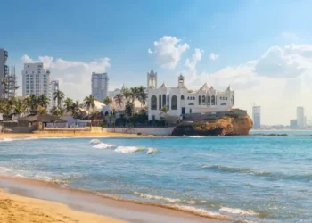 The sandy beach and resorts along the Playa Gaviotas beach at the Golden Zone of the Sinaloa Rivera, at Mazatlan, Mexico.