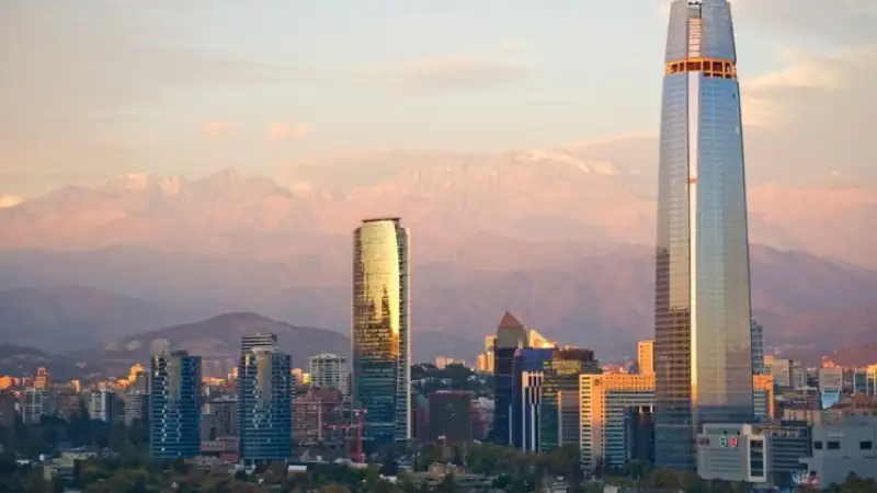 The skyline of Santiago, Chile, with modern skyscrapers—including the tall, glass-clad Gran Torre Santiago