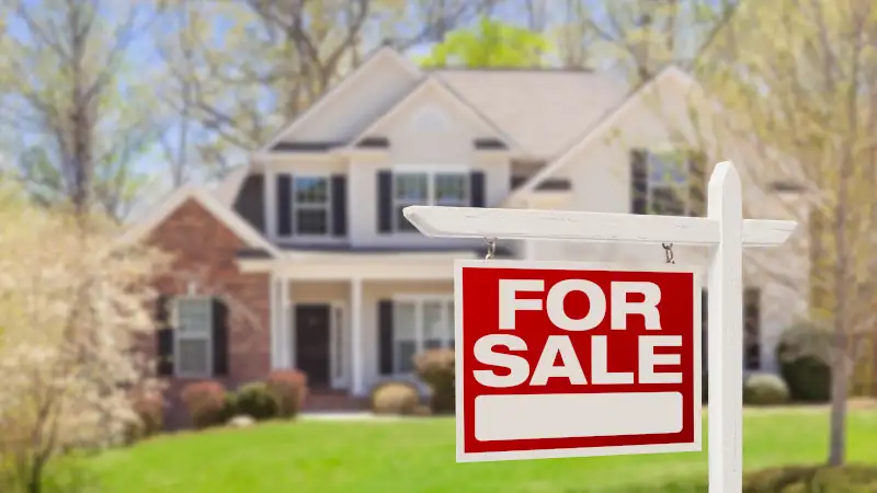 Home For Sale Real Estate Sign and House