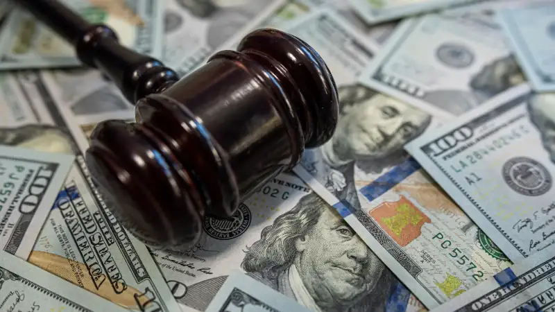 Gavel on hundred dollar bills