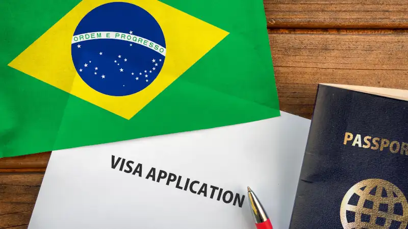 Visa application form, passport and flag of Brazil