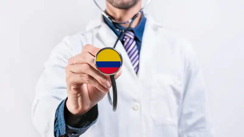 Colombia healthcare system, doctor holding stethoscope. Colombia health and medical insurance concept