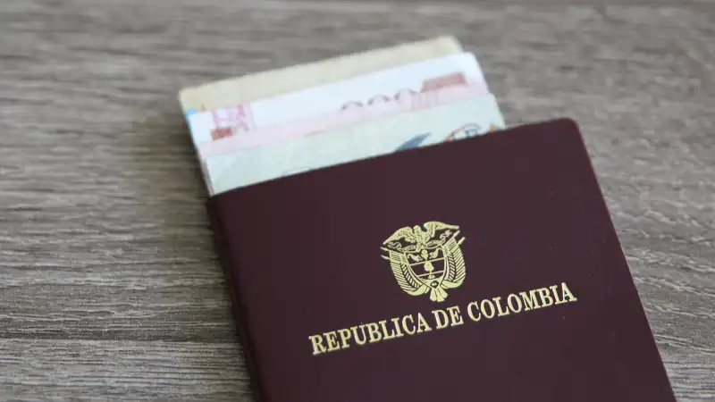 Colombian passport with bank notes