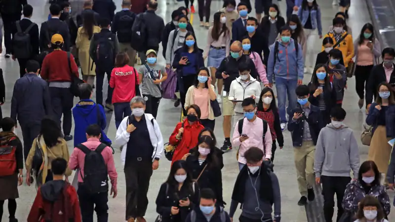masked metro crowd in hong kong