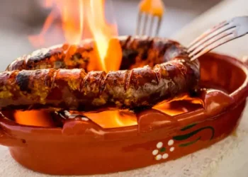 Traditional portuguese chourico or spanish chorizo prepared in a special clay pot